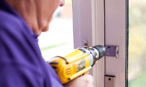 Handyperson fixing lock
